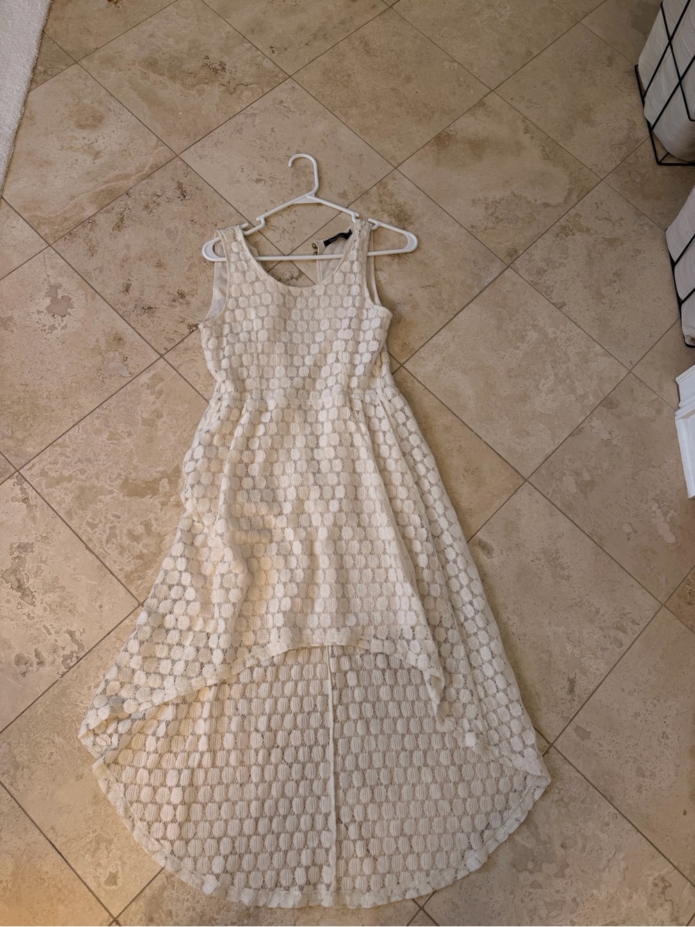 the clothing company Cream Lace High-Low Sleeveless Dress